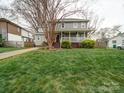 Beautiful two-story home showcasing a classic design and expansive front yard at 2729 Duncan Ave, Charlotte, NC 28205