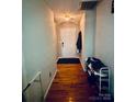 Inviting hallway features hardwood floors and access to the front door and other areas of the house at 3002 Willamette Valley Dr, Charlotte, NC 28215