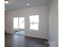 Open-concept living room with abundant natural light and sliding doors at 3509 Nimbell Rd, Monroe, NC 28110