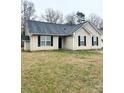 Inviting exterior featuring classic siding and a well-kept front lawn at 5702 Burning Ridge Dr, Monroe, NC 28110