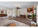 Inviting living room features a fireplace, hardwood floors, and open floor plan at 653 Camrose Ne Cir, Concord, NC 28025