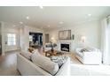 Sun-filled living room with fireplace, neutral decor, and an open layout for modern living at 908 Stanfield Dr, Charlotte, NC 28210