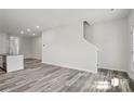 Open-concept living room boasts hard surface floors, neutral walls and an open staircase at 1211 Pine St # A, Mooresville, NC 28115