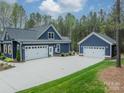 Beautiful home featuring a long drive and multiple garages for ample parking at 2125 Partridge Berry Ln, Rock Hill, SC 29730