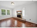 Cozy living room featuring a fireplace and hardwood floors at 2623 Shaw Ave, Gastonia, NC 28054