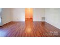 Inviting living room with beautiful wood floors and neutral paint, creating a warm and welcoming ambiance at 2623 Shaw Ave, Gastonia, NC 28054