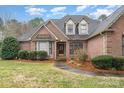 Charming brick home featuring a well-manicured front lawn at 5125 Belicourt Dr, Charlotte, NC 28277