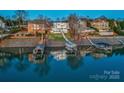 A waterfront home featuring a private dock for easy access to water activities at 7111 Anchorage Ln, Tega Cay, SC 29708