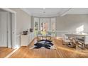 Bright dining room featuring hardwood floors, natural light, and neutral decor at 888 Craigmont Nw Ln, Concord, NC 28027