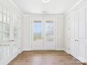 Bright entryway with wood flooring and elegant white doors and trim at 1010 Rolling Meadows Dr # Rm14, Mooresville, NC 28115