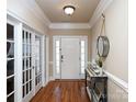 Elegant foyer with hardwood floors, console table, and decorative mirror at 105 Millwood Dr, Fort Mill, SC 29715