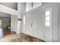 Bright foyer featuring a double front door, tile flooring, and natural light from above at 1205 Molokai Dr, Tega Cay, SC 29708