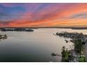 Breathtaking aerial view of the lake with serene waters and picturesque shoreline properties at 18432 Harbor Light Blvd, Cornelius, NC 28031