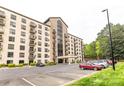 Exterior view of condo building with brick facade, multiple stories and convenient parking at 211 Heritage Blvd # 108, Fort Mill, SC 29715