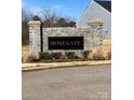 Stone Rosegate community entrance sign, enhancing curb appeal and highlighting the neighborhood's name at 247 Damask Dr, Lancaster, SC 29720