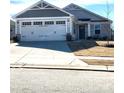 Well-maintained home with a spacious two-car garage and a pristine driveway at 247 Damask Dr, Lancaster, SC 29720