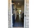 Inviting foyer featuring a blue door, wood floors, and stylish decor at 247 Damask Dr, Lancaster, SC 29720