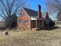 Charming brick home with a cozy front porch and a classic chimney at 3045 Woodleaf Rd, Salisbury, NC 28147
