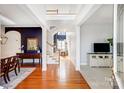 Spacious foyer with hardwood floors, open staircase, and stylish console table with a gold mirror at 3563 Valiant Sw Ave, Concord, NC 28027