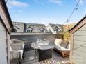 Cozy outdoor patio with lounge seating, a modern fire pit, and neighborhood views at 4010 Citra Ln, Charlotte, NC 28217