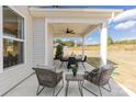 This covered patio has an outdoor seating area and plenty of space for entertaining at 4023 Vista Pine Dr, Charlotte, NC 28215
