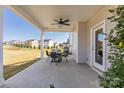 Relaxing covered patio features a ceiling fan and ample space for outdoor seating at 4023 Vista Pine Dr, Charlotte, NC 28215