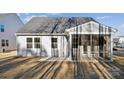 The rear of the house features a screened-in porch and a well-maintained yard at 4035 Vista Pine Dr, Charlotte, NC 28215
