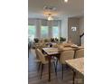 Inviting open-concept living room with hardwood floors, dining area, and abundant natural light at 4710 Lakeview Rd # Lot 10, Charlotte, NC 28216