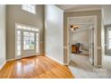 Bright foyer features soaring ceilings, gleaming hardwood floors, and entryway to the office space at 6458 Chadwell Ct # 30, Indian Land, SC 29707