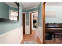 Welcoming hallway featuring classic wainscoting and hardwood floors at 662 University Dr, Rock Hill, SC 29730