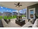 Relaxing screened-in patio with comfortable seating and views of the backyard at 9096 El Sworth Dr, Sherrills Ford, NC 28673