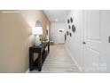 Inviting hallway features a stylish console table and decorative wall accents, setting a welcoming tone at 11205 Cardinal Creek Ave, Charlotte, NC 28215