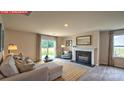 Comfortable living room has a fireplace and plush seating, perfect for relaxation at 11205 Cardinal Creek Ave, Charlotte, NC 28215