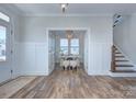 Bright office space featuring wood floors, a chandelier, and French doors at 1176 Weir Ct, Fort Mill, SC 29708