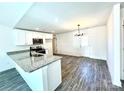 Eat-in kitchen features stainless steel appliances, granite countertops, white cabinets, and modern lighting at 1350 Russell St, Rock Hill, SC 29730