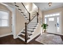 Elegant foyer with hardwood floors, staircase, and a bright entryway at 2172 Paddlers Cove Dr, Clover, SC 29710