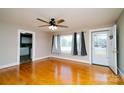 Bright living room featuring hardwood floors, neutral walls, and natural light from large windows at 3039 N Center St # 10/C, Hickory, NC 28601