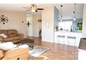 Cozy living room featuring hardwood floors, modern decor, and a comfortable seating area at 3991 Bunker Hill School Rd, Claremont, NC 28610