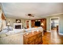 Cozy living room with hardwood floors, fireplace, and comfortable seating arrangement at 401 N Inman Ave, Bessemer City, NC 28016