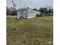 Single-story home with neutral siding and a small back deck area at 412 Sumter St # A, Clover, SC 29710