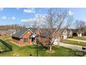 Beautiful brick home with manicured lawn and mature trees in a residential neighborhood at 4405 Zee Ct, Monroe, NC 28110
