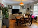 Bright dining room with a wooden table, decorative chandelier, and stylish decor for Gathering meals at 618 N Ellis N St, Salisbury, NC 28144