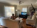 Inviting living room with hardwood floors, neutral decor, and ample natural light streaming through the windows at 618 N Ellis N St, Salisbury, NC 28144