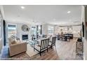 Spacious open-concept living room with fireplace flowing seamlessly into dining area and modern kitchen at 8712 Acadia Pkwy # 595, Sherrills Ford, NC 28673