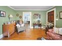 Cozy living room with hardwood floors, neutral walls, and classic trim, offering a warm and inviting atmosphere at 940 N New Hope Rd, Gastonia, NC 28054
