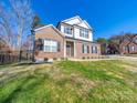 Charming brick home with black shutters and well-maintained landscaping at 1004 Loganberry Ln, Salisbury, NC 28146
