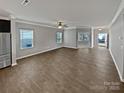 Spacious open-concept living room features hardwood floors and ample natural light at 113 Clove Hitch Dr, Statesville, NC 28677