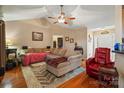 Comfortable living room with cozy seating, wood floors, and a ceiling fan at 1275 Rocky Ridge Trl, Salisbury, NC 28146