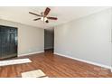 Open living room with hardwood floors and a view into the hallway at 1961 Franklin St, Rock Hill, SC 29732