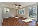 Sunlit living room featuring gleaming hardwood floors and a view to the front yard at 1961 Franklin St, Rock Hill, SC 29732